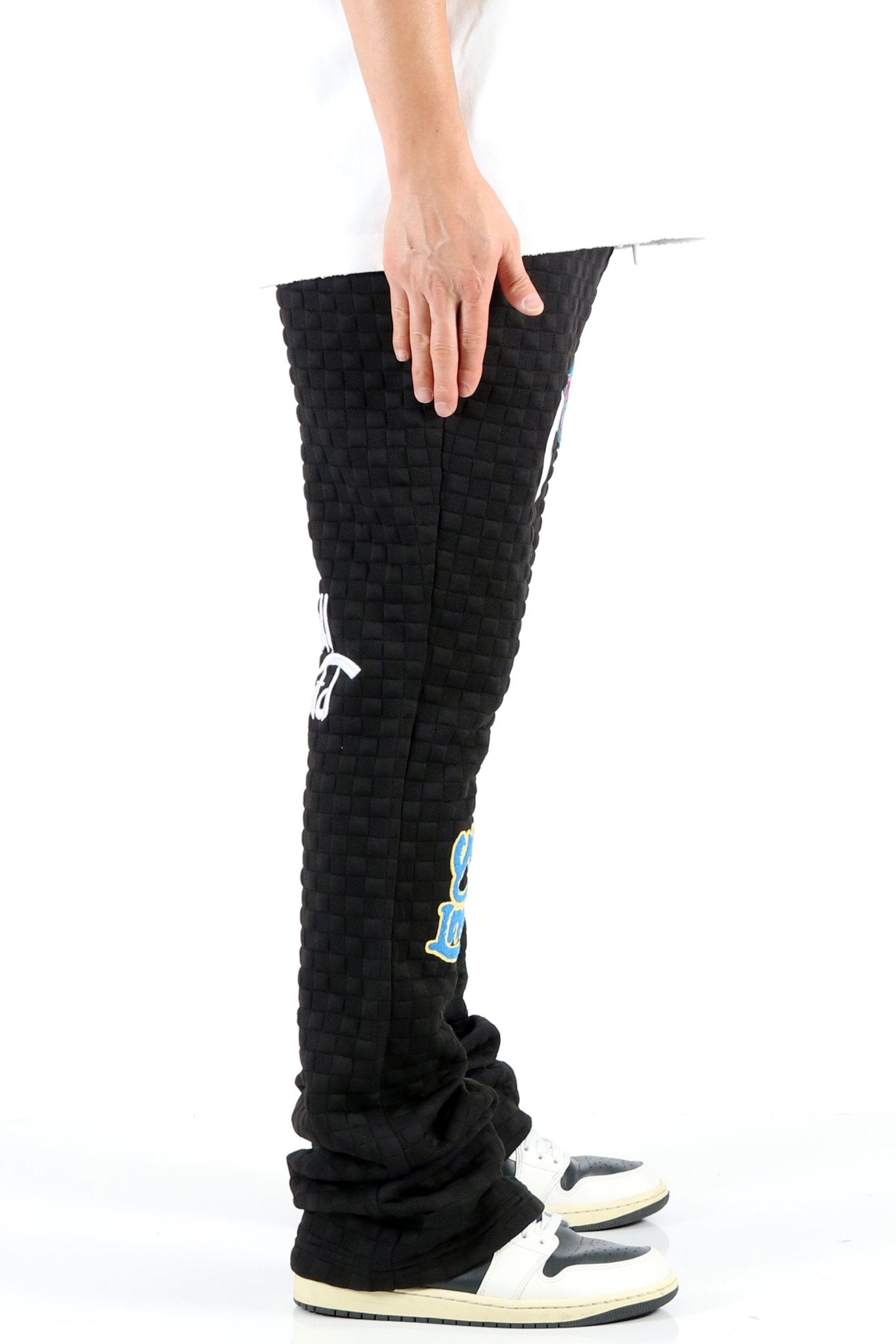 KUROI Waffle fleece graphic skinny flare stacked pants